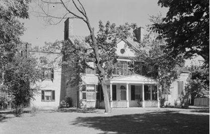Maple's Feature 1800's style home surrounded by trees